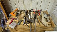 All tools laid out on wooden surface