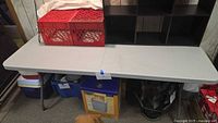 Full view of Office Star folding table with items on top and underneath not included