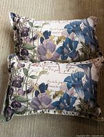 Front view of both pillows showing floral design