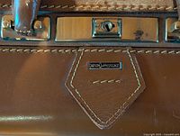 Carson Luggage badge, lock plate, leather detail