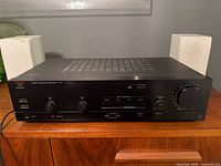 Front view showing Luxman LV-111 amplifier faceplate and controls