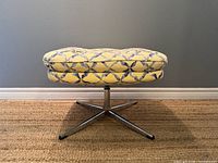 Front view of ottoman showing cushion pattern and base