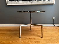 Side view showing chrome tripod base and profile