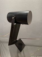 Left profile showing Lucite Z base and metal cylinder head