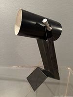 Front angled view showing Lucite Z base and metal cylinder head