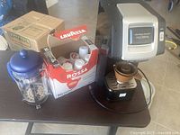Overall lot showing FlexBrew machine, French press and Lavazza pod box