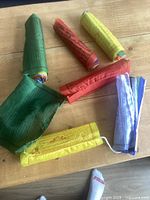 Rolled prayer flag banners laid out showing colours and printed script