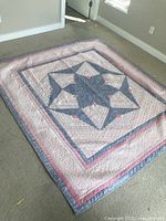 Full view of quilt laid flat showing overall design and size