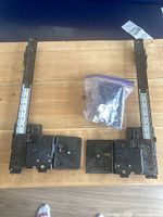 Pair of slide assemblies and bag of hardware on table