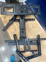 Overall view of pull-down TV wall mount with attached brackets