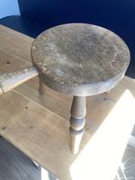 Top view showing worn wooden seat and handle