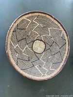 Top view of round woven basket showing full geometric pattern