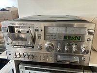 Front view of Yorx stereo system showing cassette deck, tuner, controls, digital clock