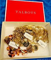 Red Talbots box containing three tagged gold-tone chain necklaces