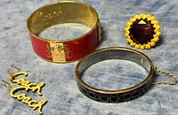 Group shot of both bangles, earrings pair, cocktail ring