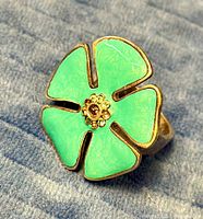 Front view of ring showing full flower design and enamel colour