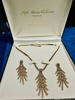 Open presentation box showing necklace and earrings set