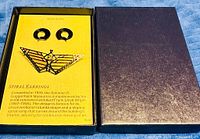 Set in box showing both earrings and brooch