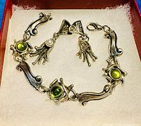 Full view of bracelet and earrings in box