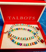 Pair of multicolor beaded bangles inside red Talbots box