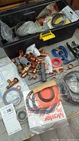 Entire lot in toolbox showing fittings, washers, tools