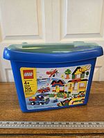 Blue LEGO tub with set label indicating 5508, 704 pieces