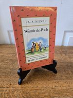 Front cover on stand showing title, author, illustrator