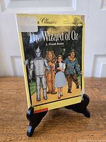 Front cover of Apple Classics "The Wizard of Oz" paperback on stand