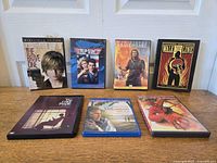 All seven disc cases lined up on tabletop