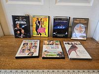 All seven DVD cases displayed upright and flat