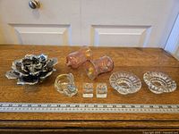Group shot of all eight candle holders with ruler for scale