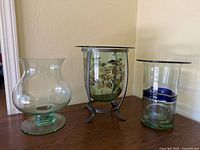 All three glass vases grouped on table