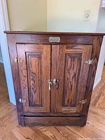 Front view of oak cabinet closed