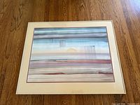 Full view of framed watercolor painting on floor