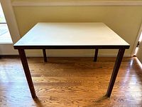 Full view of the square table showing top and legs