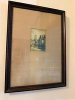 Full view of framed watercolor under glass