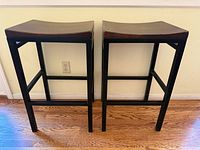 Both stools front view showing frames and seats