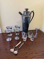 Full set showing shaker, coupes, shot glasses, jigger, spoons