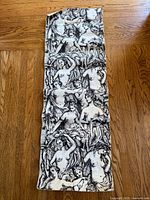 Full view of long printed paper sheet on floor