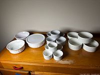 All dishes and ramekins arranged on surface for full lot view
