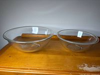 Both Pyrex glass mixing bowls side by side