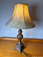 Full view of lamp with shade illuminated