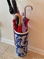 Overall view of ceramic stand filled with umbrellas