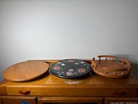 Front view of all three wooden lazy Susans side by side