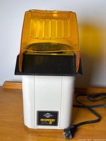 Front view showing West Bend Poppery II label and overall unit