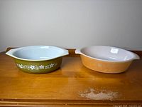 Both casserole dishes side by side showing exteriors and size comparison