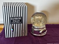 Box and water globe side by side