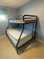 Full view of bunk bed with mattresses
