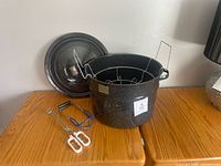 Canner pot with rack inside, lid, jar lifter, tongs