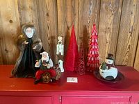Group shot of all Christmas décor pieces on cabinet